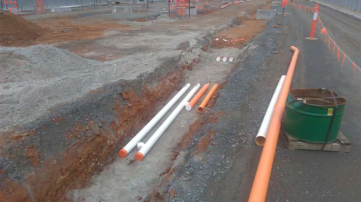 Combined service route conduit installation