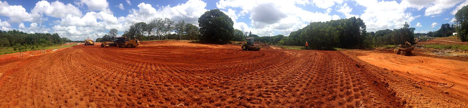 Cut to fill with roller, scraper, excavator, moxy and grader