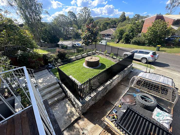 Hand laid stone retaining wall completed