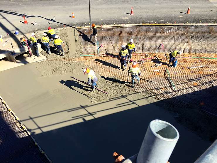 Large concrete drainage channel being poured