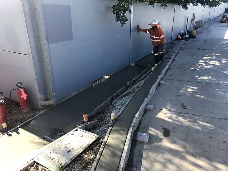 Minor concrete V‑drain and kerb pour