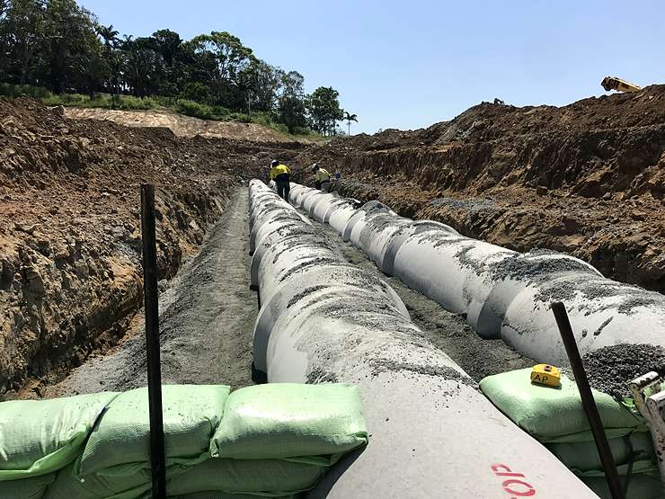 Twin barrel RCP with haunching being compacted